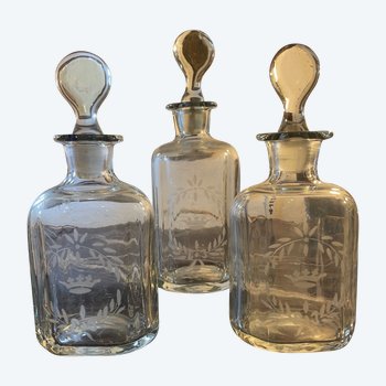 Three engraved glass bottles 19th century