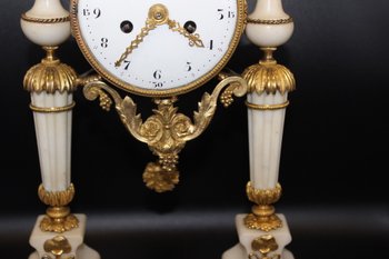 Late Louis XVI Period Portico Clock In Marble And Gilt Bronze