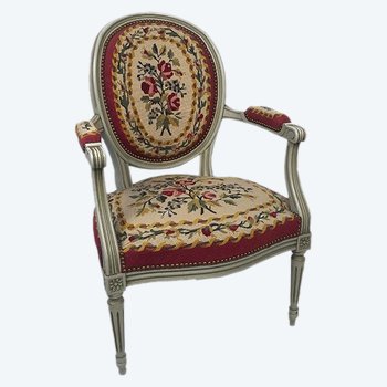 Louis XVI style armchair in gray lacquered wood, medallion backrest, upholstered with petit point tapestry