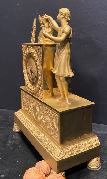 Empire clock in gilded bronze
