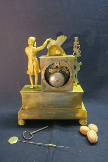 Empire clock in gilded bronze