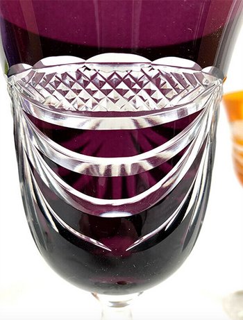 Set of five colored cut crystal stemware