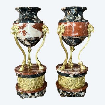 Pair of gilt bronze and marble cassolettes, decorated with rams' heads