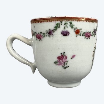 A c1790 Chinese export porcelain armorial coffee cup painted with floral swags