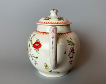 A rare & charming Bow miniature teapot, c1760, bullet form, polychrome decorated