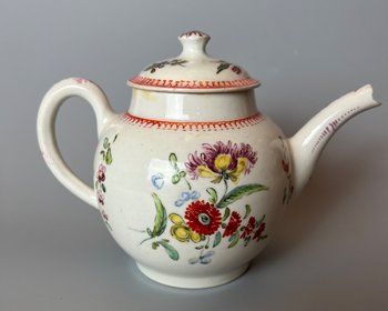 A rare & charming Bow miniature teapot, c1760, bullet form, polychrome decorated