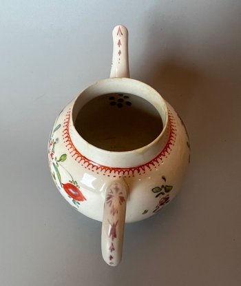 A rare & charming Bow miniature teapot, c1760, bullet form, polychrome decorated