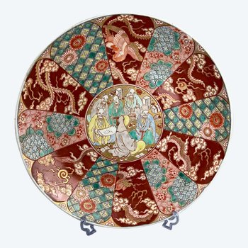 A Japanese Meiji period charger decorated with figures, dragon and Hou-ou bird