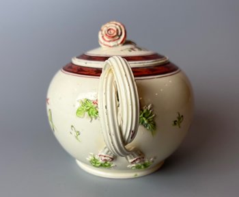 A Leeds Creamware Ovoid Teapot and Cover, c.1775,  with entwined handles.