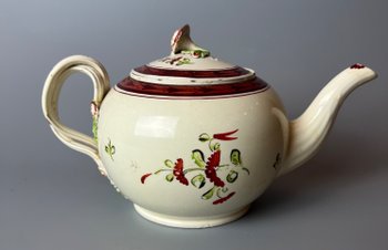 A Leeds Creamware Ovoid Teapot and Cover, c.1775,  with entwined handles.