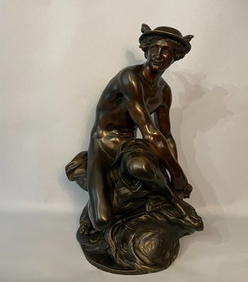 Sculpture en bronze"Mercure attachant ses talonnières". J-B Pigalle. (Hermès).