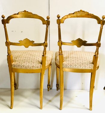 Pair of gilded wooden chairs