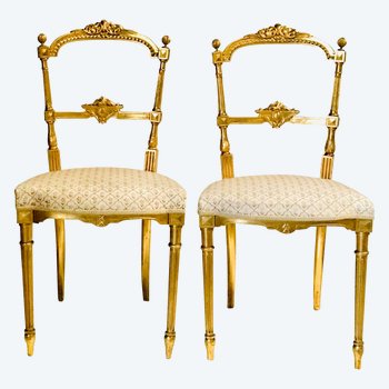 Pair of gilded wooden chairs