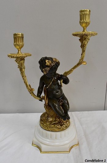 Coppia di candelabri in bronzo "Un Amour et un Faune", da Clodion e Delarue - Fine XIX secolo