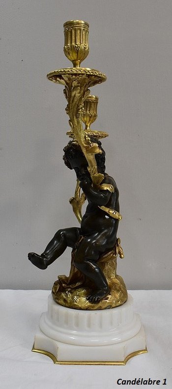 Coppia di candelabri in bronzo "Un Amour et un Faune", da Clodion e Delarue - Fine XIX secolo