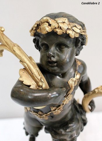 Coppia di candelabri in bronzo "Un Amour et un Faune", da Clodion e Delarue - Fine XIX secolo