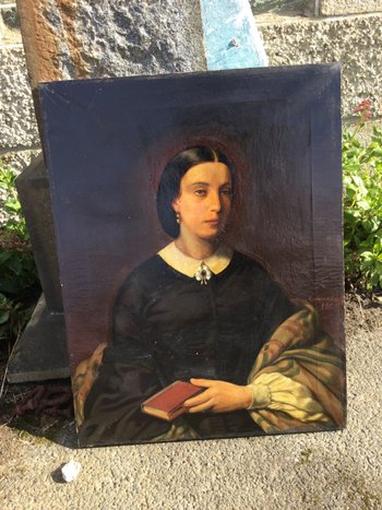 Porträt einer Frau mit einem Buch.1860