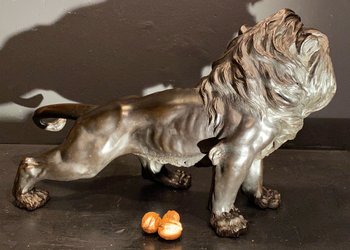 bronze walking lion
