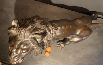 bronze walking lion