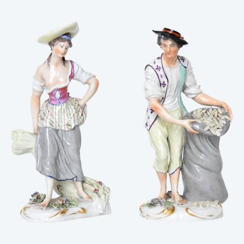 Pair of porcelain statuettes of Samson representing a couple of peasants