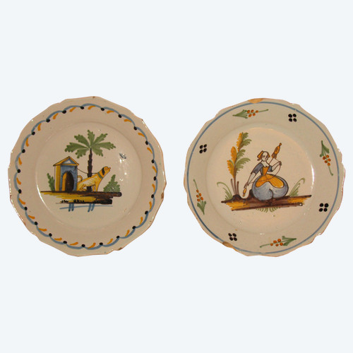 Pair of earthenware plates from Nevers, 18th century: the spinner - the dog