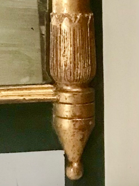 Miroir en bois doré et teinté de style Empire XIXème 