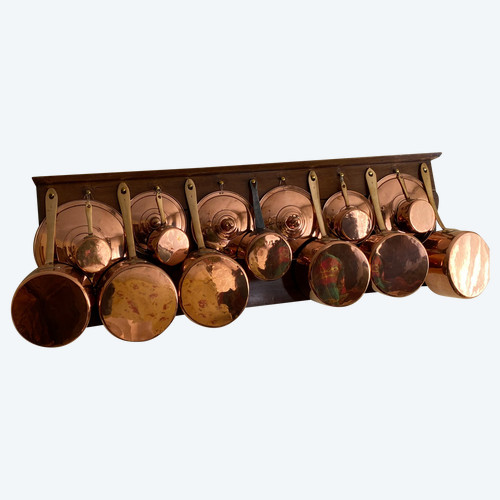 Series of copper saucepans and lids