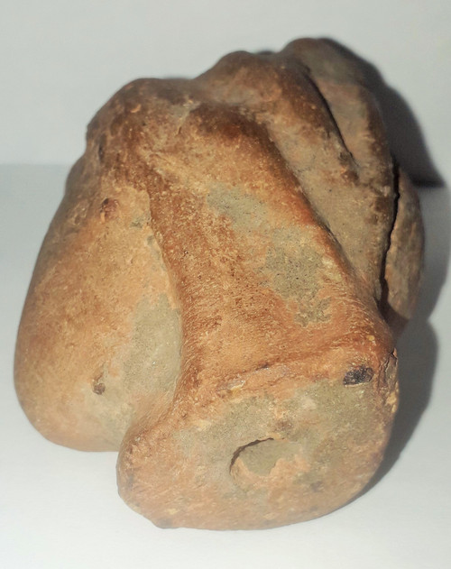 Antique head of a woman with a highlighted hairstyle raised in a high bun terracotta height 7.2 width 4 depth 5.5 cm