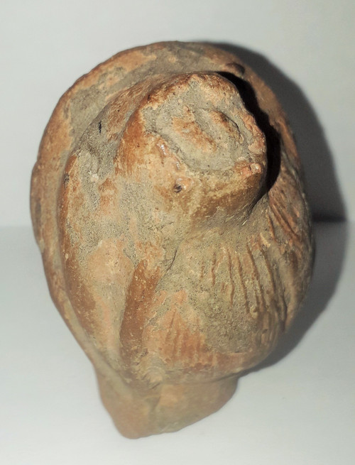 Antique head of a woman with a highlighted hairstyle raised in a high bun terracotta height 7.2 width 4 depth 5.5 cm