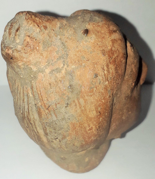 Antique head of a woman with a highlighted hairstyle raised in a high bun terracotta height 7.2 width 4 depth 5.5 cm