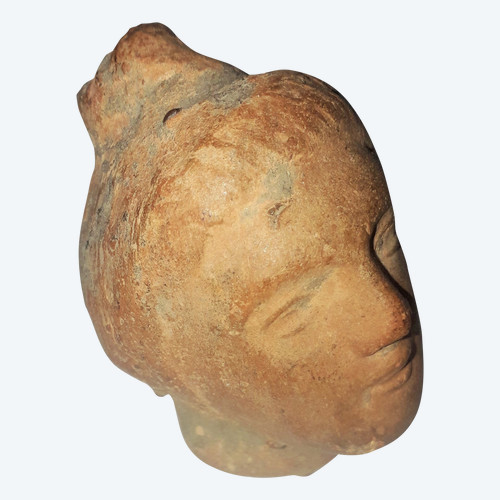 Antique head of a woman with a highlighted hairstyle raised in a high bun terracotta height 7.2 width 4 depth 5.5 cm