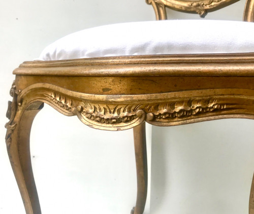 Louis XV Rocaille style chair in gilded wood