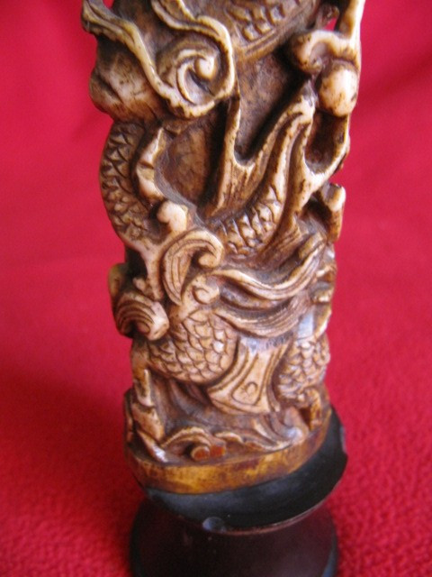 Chinese bone sculpture on blackened wooden base late 19th