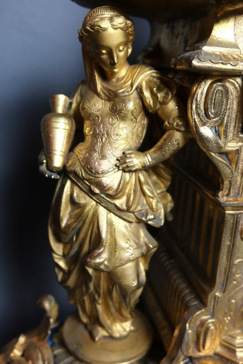 19th century clock with golden regula and colored enamelled earthenware