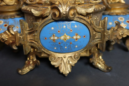 19th century clock with golden regula and colored enamelled earthenware