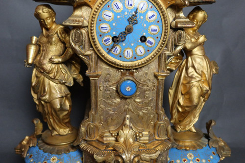 19th century clock with golden regula and colored enamelled earthenware
