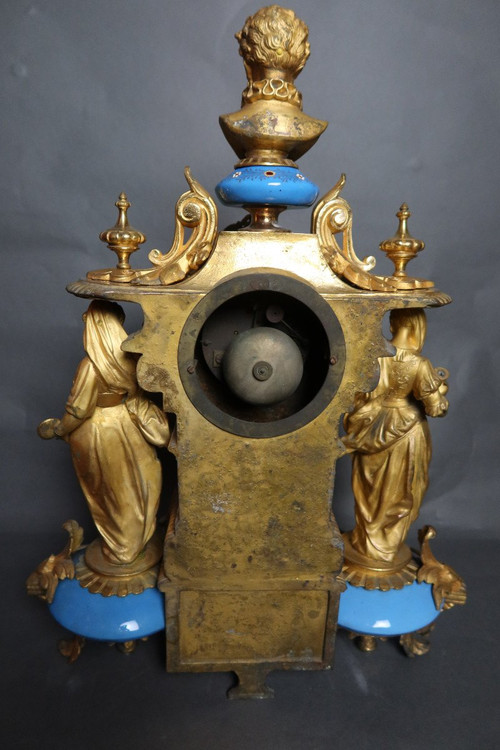 19th century clock with golden regula and colored enamelled earthenware