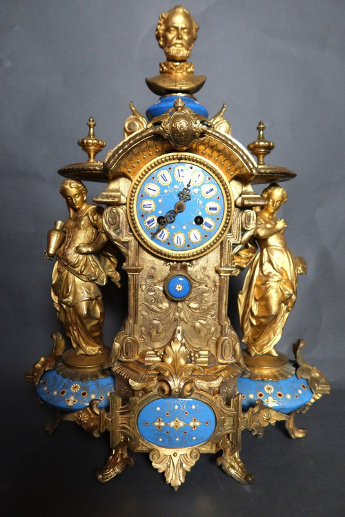 19th century clock with golden regula and colored enamelled earthenware