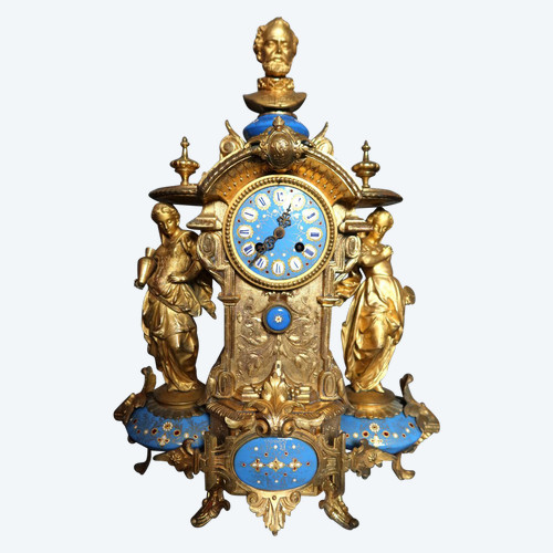 19th century clock with golden regula and colored enamelled earthenware