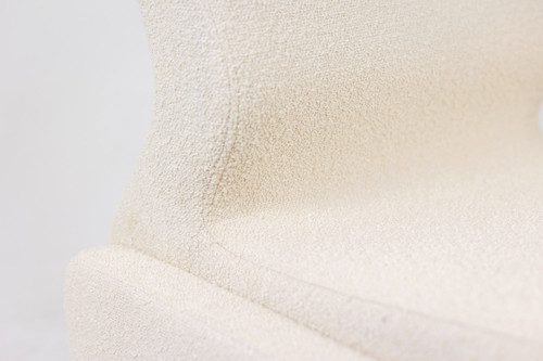 Pair of white bouclé low chairs, 1970s