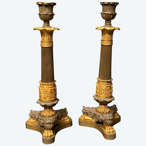 coppia di candelieri in bronzo con due patine