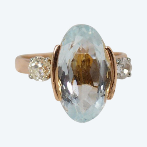 Rose Gold Ring Adorned With An Oval Aquamarine And Diamonds