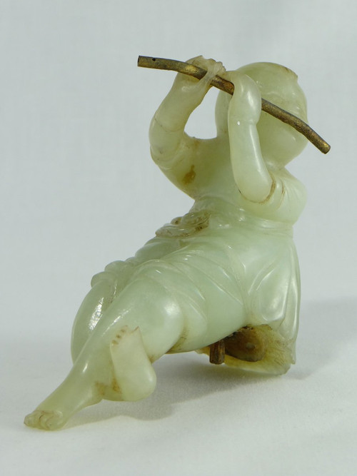 China Circa 1900, Jade Sculpture of a Child Playing the Flute.