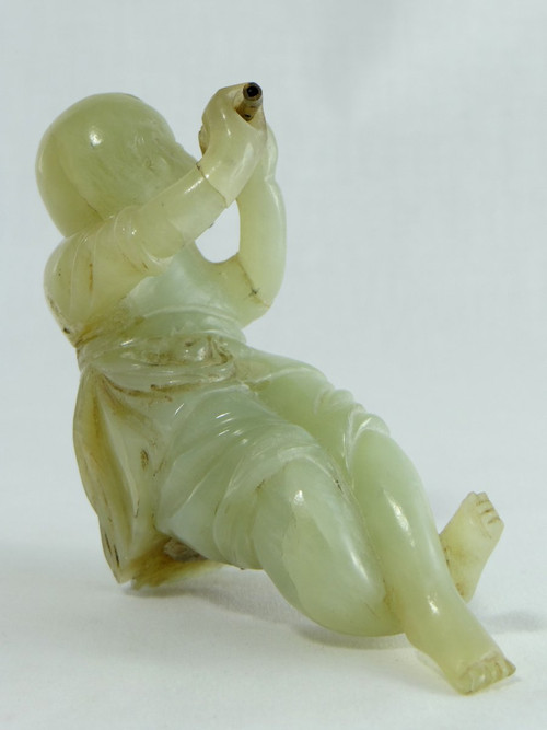 China Circa 1900, Jade Sculpture of a Child Playing the Flute.