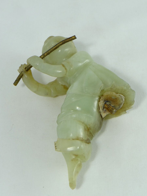 China Circa 1900, Jade Sculpture of a Child Playing the Flute.