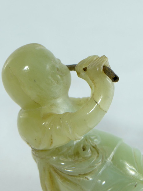 China Circa 1900, Jade Sculpture of a Child Playing the Flute.