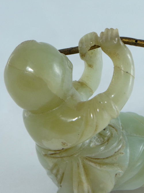 China Circa 1900, Jade Sculpture of a Child Playing the Flute.