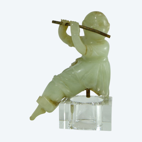 China Circa 1900, Jade Sculpture of a Child Playing the Flute.