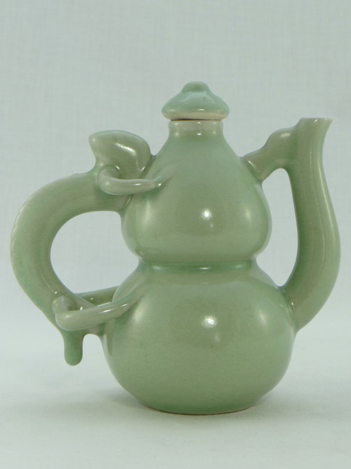 China, Mid-20th Century, Celadon porcelain teapot, two-lobed form.