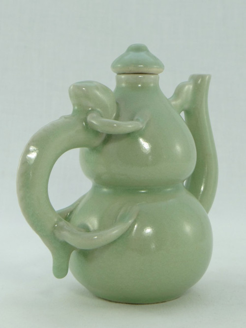 China, Mid-20th Century, Celadon porcelain teapot, two-lobed form.